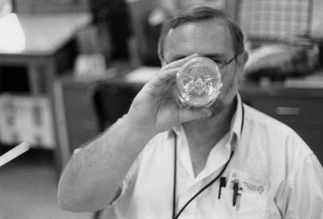 My photography teacher, Mr. Ray, with his face obscured by a water bottle that he is drinking from